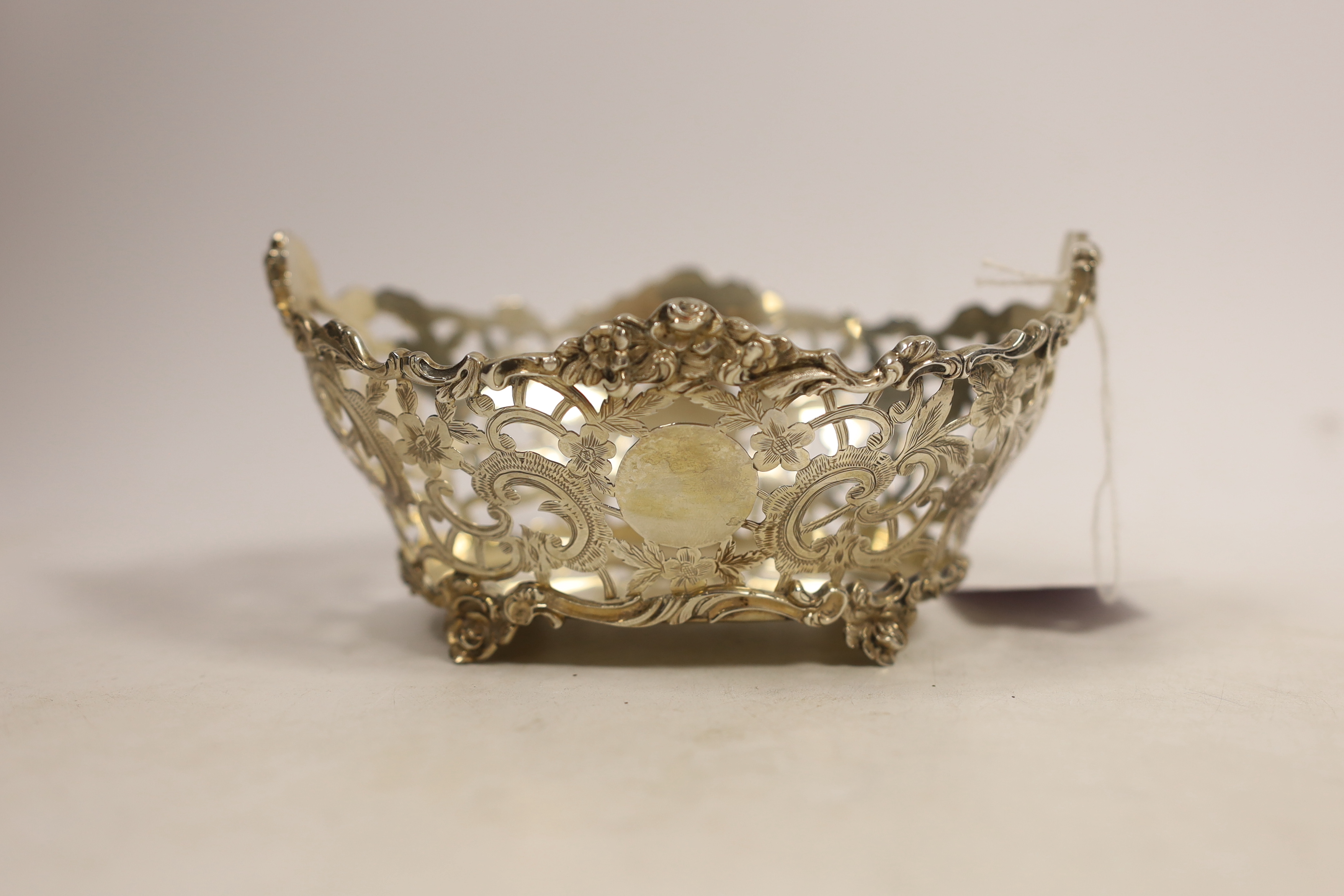 A George V pierced silver sweetmeat bowl, Charles Stuart Harris & Sons, London, 1913, length 15.3cm, 6.2oz.